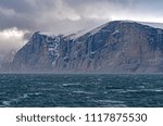 Dramatic Cliffs Above Storm Tossed Seas in the Sam Ford Fjord on Baffin Island in Nunavut, Canada