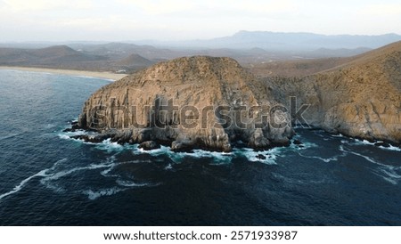 Dramatic cliffs and ocean waves at Punta Lobos, Baja California.