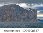 Dramatic Cliffs on a Cloudy Day in Sam Ford Fjord on Baffin Island in Nunavut, Canada