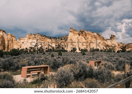 Dramatic cliffs stand above a scenic expanse at a notable desert site.