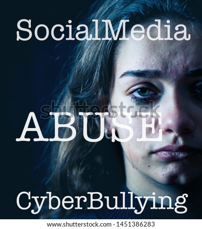 Dramatic closeup portrait of upset desperate girl bullied online suffering harassment crying and feeling intimidated. Child victim of cyberbullying,stalker, social media and dangers of the Internet.