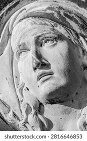 Dramatic close-up of the Virgin Mary statue gazing toward heaven, expressing sorrow, faith, hope, and unwavering devotion.