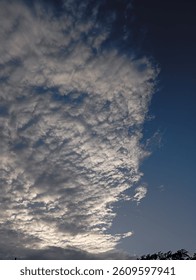 Dramatic Cloud Formation in the Blue Sky at Dusk