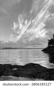 Dramatic Cloud Formation Over Calm Norwegian Coast in Black and White
Powerful cloud formations stretching across a calm coastal landscape in Norway. Black and white fine art photography highlighting reflections, rugged shoreline, and dramatic Scandinavian skies.