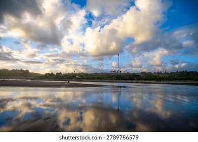 Dramatic Cloud Reflections Over Tropical Coastal Wetlands