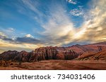 Dramatic clouds cover the sky over the mountains in Snow Canyon state park in St. George, Utah