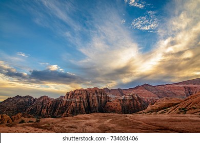 Dramatic clouds cover the sky over the mountains in Snow Canyon state park in St. George, Utah