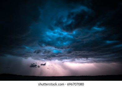 Dramatic clouds and lightning during a summer thunderstorm. Tartu, Estonia. - Powered by Shutterstock - Get 15% off with code: PIKWIZARD15