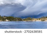 Dramatic clouds move in over the Yellowstone River near Mud Volcano, Yellowstone National Park, WY