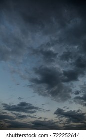 Dramatic clouds. No sun. Blue sky overlay.