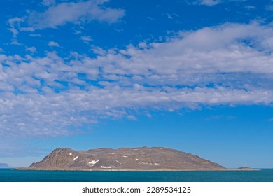 Dramatic Clouds over a Barren Arctic Island in theclouds, cloudscape, dramatic  Svalbard Islands in Norway