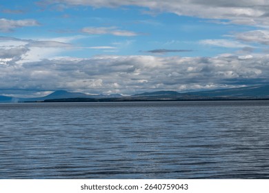 Dramatic Clouds Over a Calm Mountain Lake