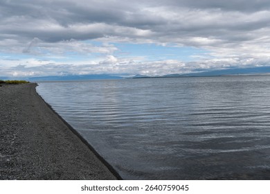 Dramatic Clouds Over a Calm Mountain Lake