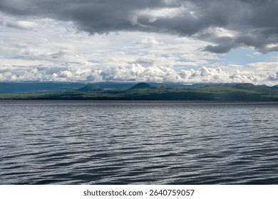 Dramatic Clouds Over a Calm Mountain Lake