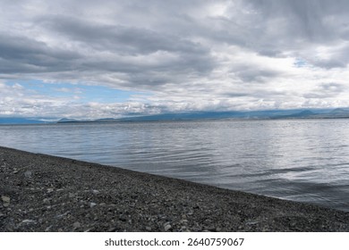 Dramatic Clouds Over a Calm Mountain Lake - Powered by Shutterstock - Get 15% off with code: PIKWIZARD15