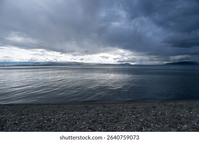 Dramatic Clouds Over a Calm Mountain Lake