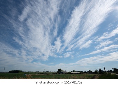 Dramatic clouds over a green pasture in California. Great for Sky replacement use