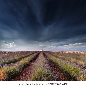 Dramatic Clouds Over Lavender Field With Chapel