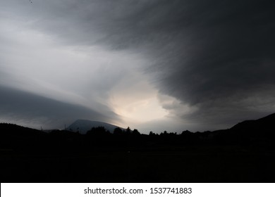 Dramatic clouds over mountain in the evening
