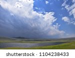Dramatic clouds over a mountain lake