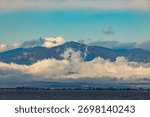 Dramatic clouds over mountain ridge and Thermaic Gulf coastline near Thessaloniki, Northern Greece.