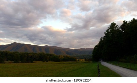 Dramatic Clouds Over Mountain at Sunset