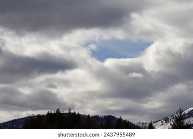 Dramatic clouds over the mountains of the Alps in spring