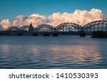dramatic clouds and railway bridge in Riga city