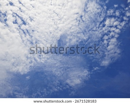 Dramatic clouds with soft blue sky in sunny day, aesthetics nature landscape background