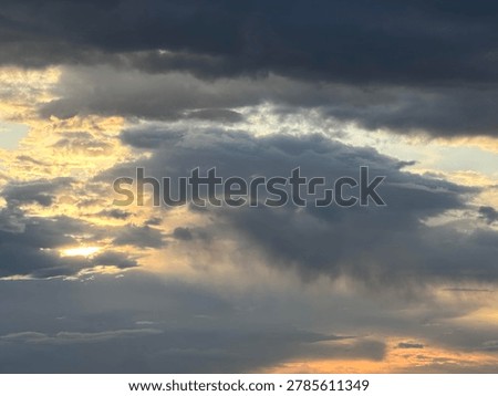 Dramatic clouds at sunset creating colorful natural sky background and evening outdoor atmosphere