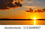 Dramatic clouds and sunset over Lake Irving in Bemidji Minnesota