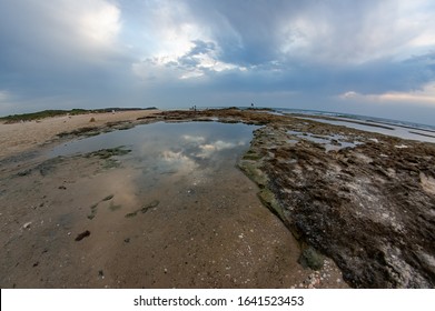 Dramatic clouds under water and windy weather sunset