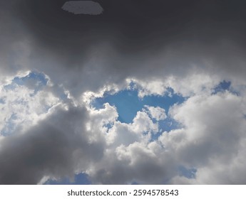 Dramatic Cloudscape: A Celestial Ballet of Light and Shadow