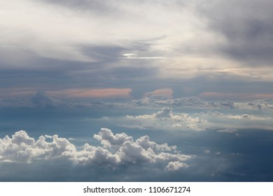 Dramatic cloudscape during sunset from the airplane's window