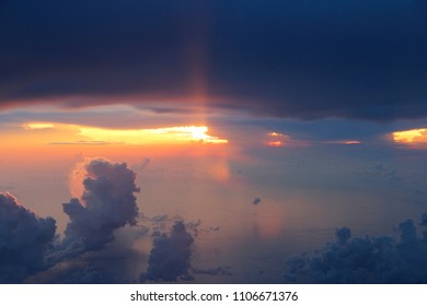 Dramatic cloudscape during sunset from the airplane's window