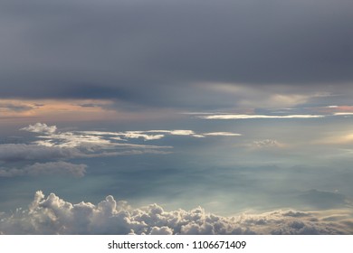 Dramatic cloudscape during sunset from the airplane's window