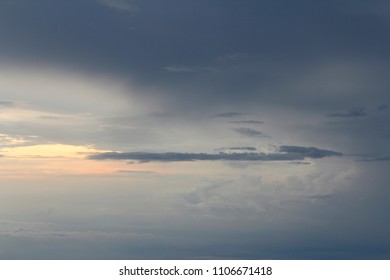 Dramatic cloudscape during sunset from the airplane's window