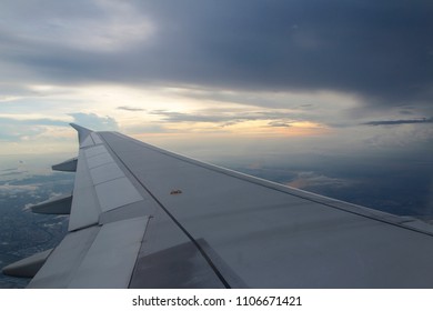 Dramatic cloudscape during sunset from the airplane's window