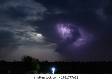 Dramatic cloudscape with moonlight and thunderbolt lightning