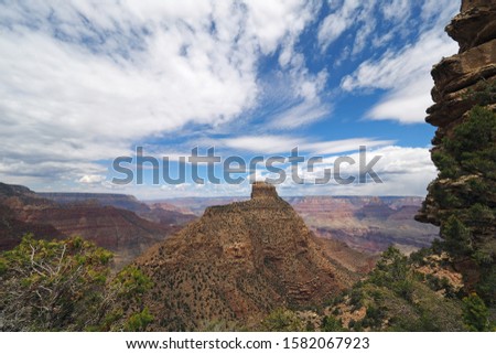 Dramatic cloudscape over Coronado Butte in Grand Canyon National Park from New Hance Trail on summer morning.