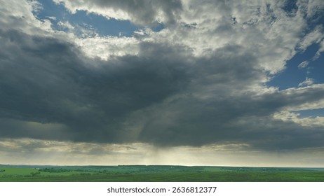 A Dramatic Cloudscape Over a Lush Green Landscape, Capturing Its Enchanting Beauty Time lapse.