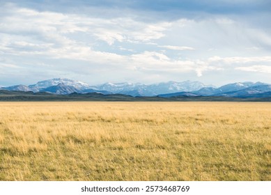 Dramatic Cloudscape Over Snowy Mountains