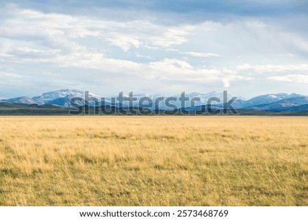 Dramatic Cloudscape Over Snowy Mountains