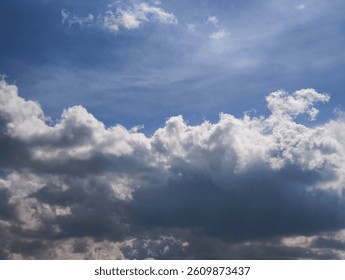 Dramatic cloudscape revealing stark contrast between luminous white and deep grey atmospheric layers