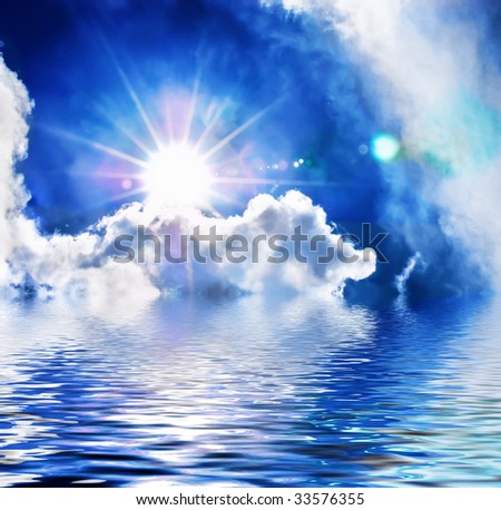 Dramatic cloudscape with sun reflected in the water