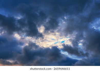 Dramatic cloudscapes with dark and light clouds. Sky is filled with a variety of cloud formations creating rainy weather patterns