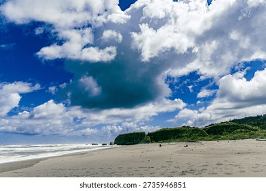 Dramatic Cloudy Sky Above Remote Sandy Coastline