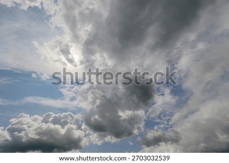 A Dramatic Cloudy Sky adorned by Radiant Sunlight, Capturing Natures Beauty and Artistry