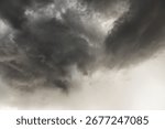 Dramatic cloudy sky with dark storm clouds and overcast atmosphere, heavy rain threatening weather, moody sky scene showing turbulent weather conditions.