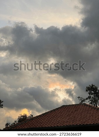 Dramatic cloudy sky with a hint of orange sunset light